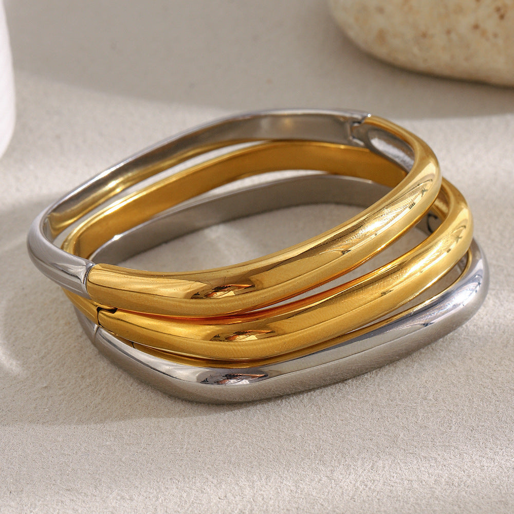 Bracciale a Polsino Tondo Irregolare Minimalista da Donna in Acciaio Inossidabile con Placcatura in Oro 18K