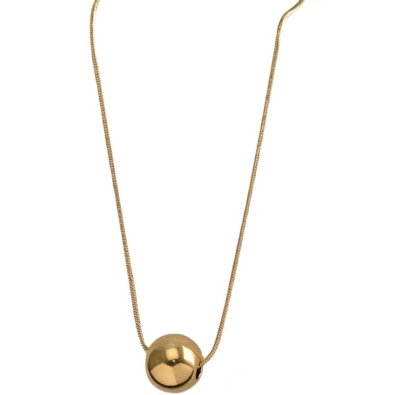 Collana da donna minimalista con pendente a sfera in acciaio al titanio con placcatura in oro e catena a serpente