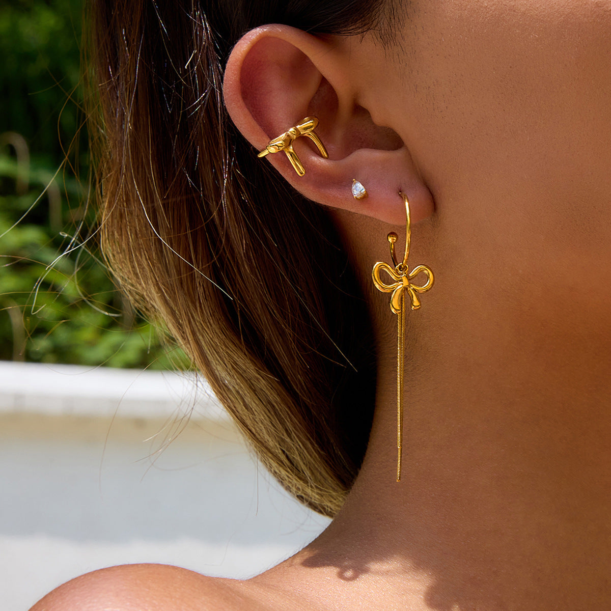 Pendientes de borla de lujo con forma de lazo de acero inoxidable para mujer con acabado chapado