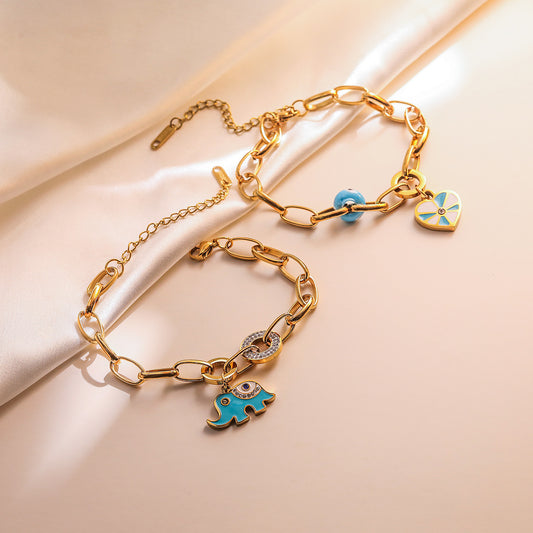Bracciale Minimalista Geometrico a Cuore con Elefante in Acciaio al Titanio da Donna con Intarsio di Strass e Finitura Smaltata
