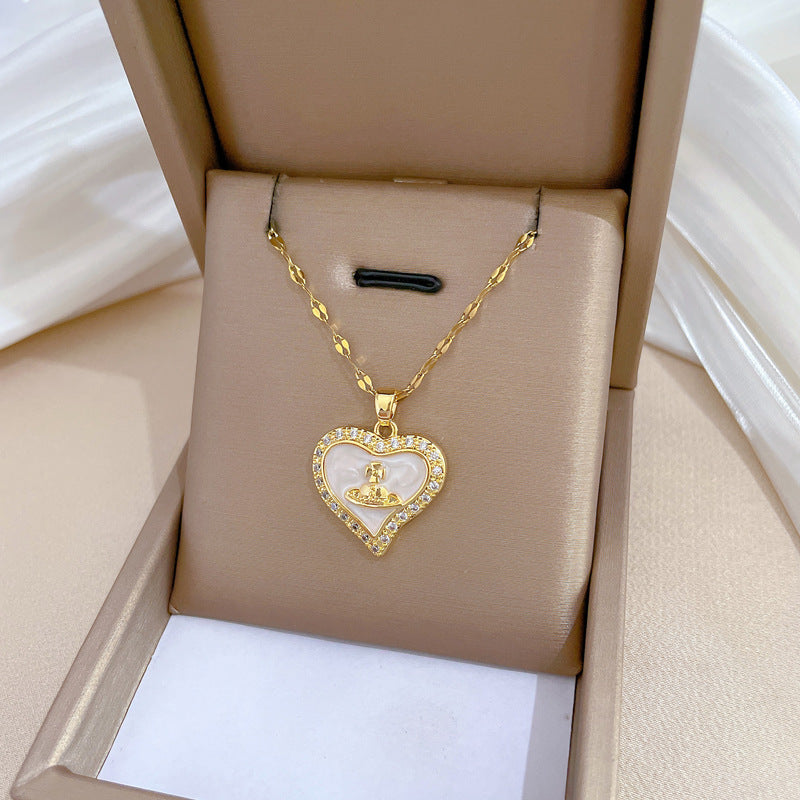 Collana con pendente a cuore e pianeta minimalista da donna e uomo con intarsio di zirconi su catena a serpente in acciaio al titanio