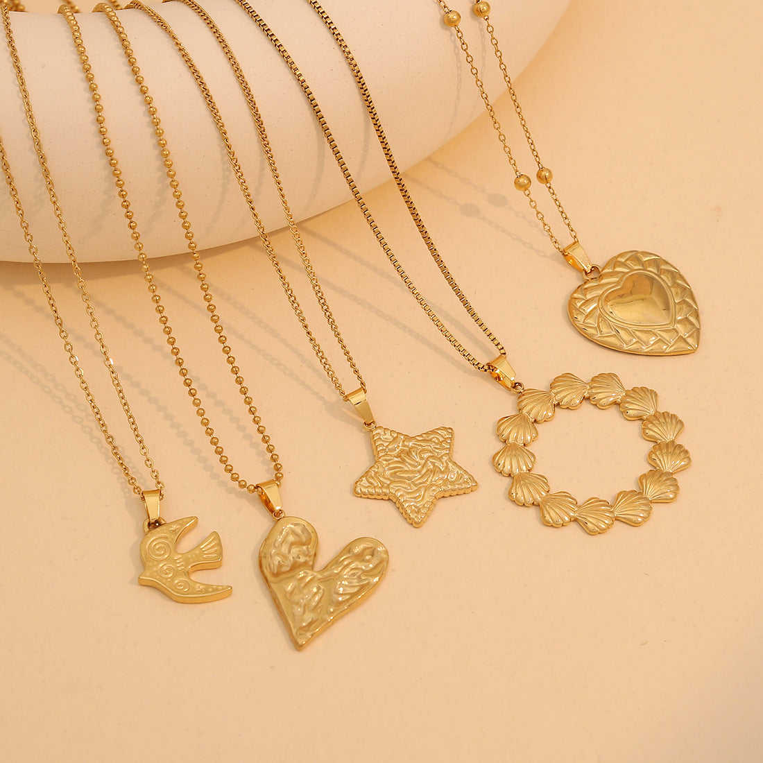 Heart-Shaped Sun Pendant Necklace in Stainless Steel for Women with Romantic and Playful Design