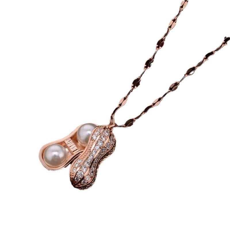 Collar con colgante minimalista de acero de titanio con forma de cacahuete y circonitas para mujer