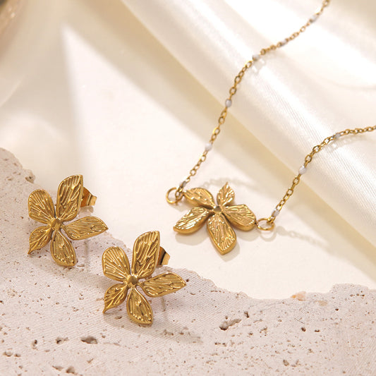 Juego de collar y pendientes chapados en acero inoxidable con diseño floral geométrico minimalista para mujer