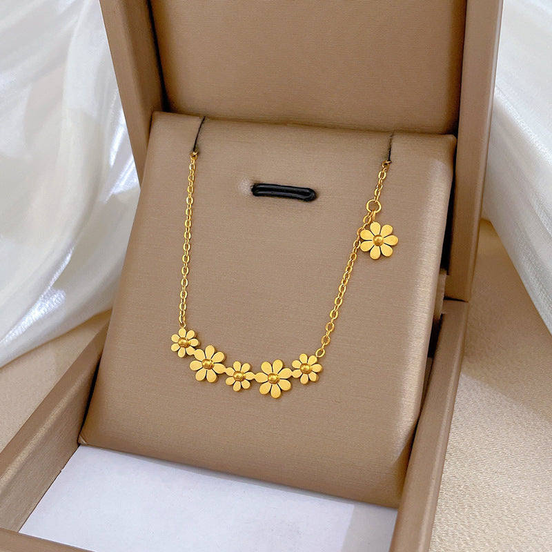 Collana girocollo minimalista in acciaio al titanio con motivo floreale
