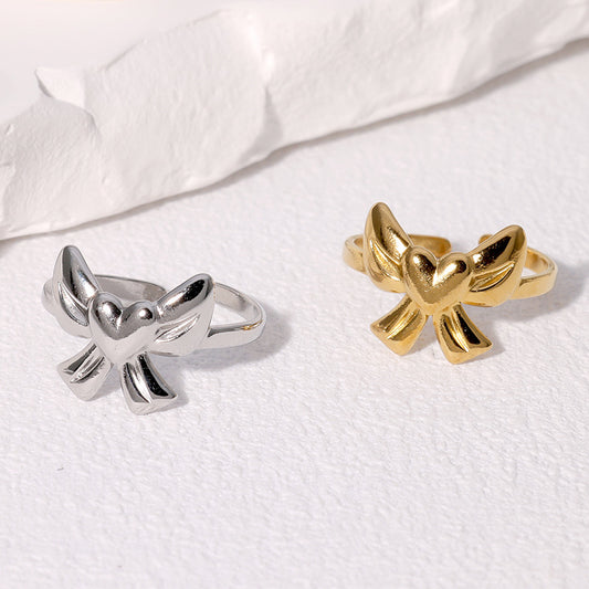 Dulce anillo abierto de acero inoxidable chapado en oro de 18 quilates con diseño de corazón y lazo para mujer