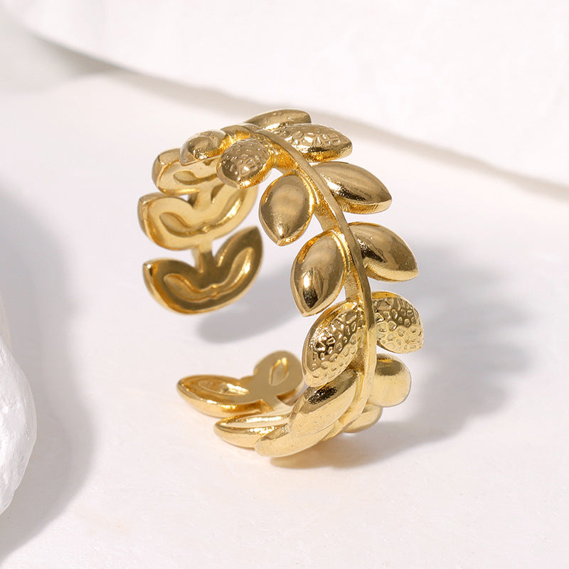 Anello da donna regolabile a fascia aperta in acciaio inossidabile placcato oro 18K a forma di foglia, stile minimalista