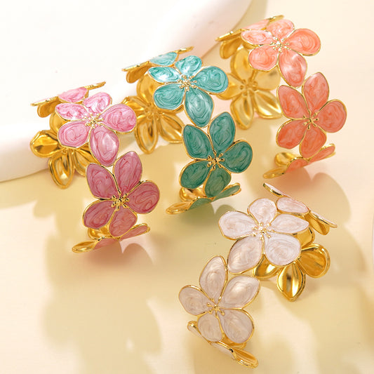 Pulsera abierta de acero inoxidable con goteo floral geométrico para mujer