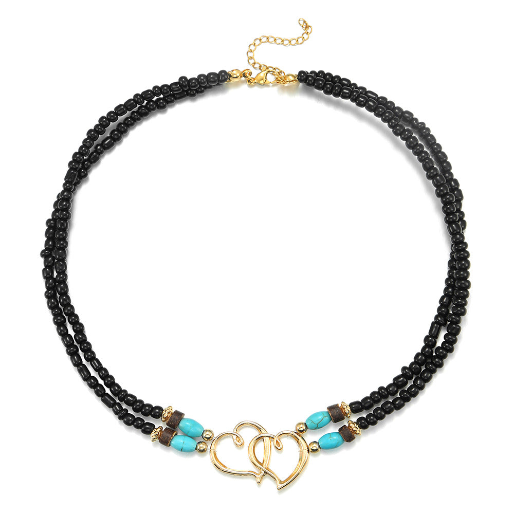 Collana da donna fatta a mano a doppio strato a forma di cuore in lega con perline turchesi su catena a O