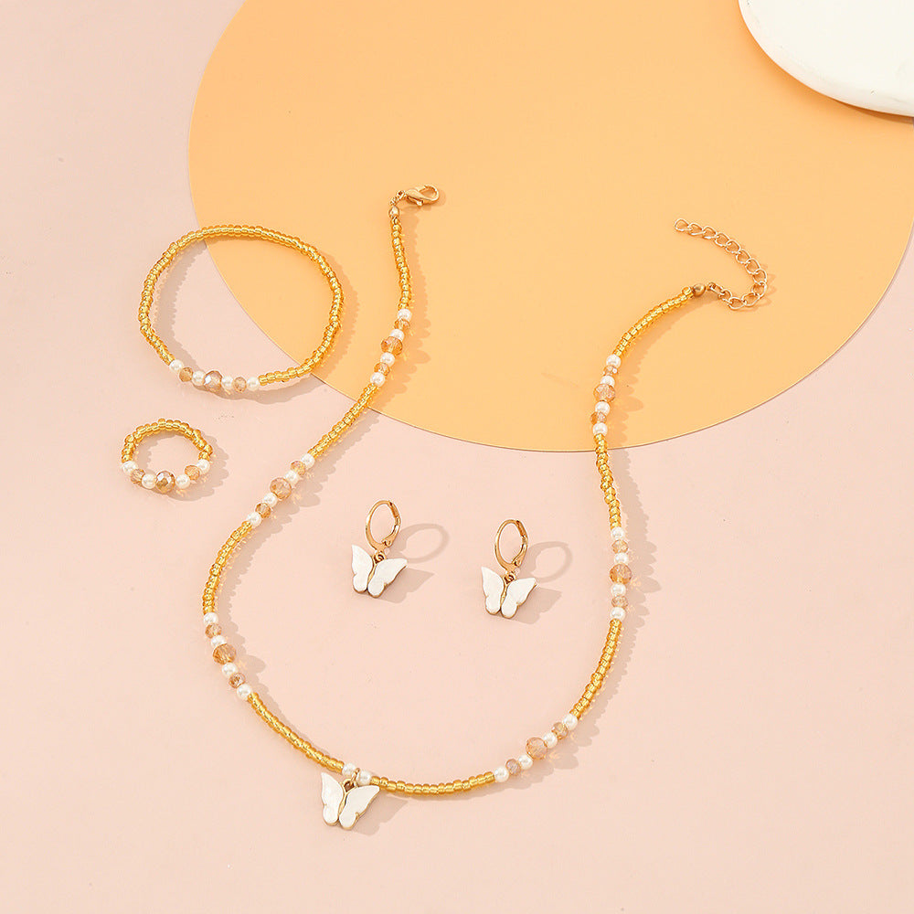 Set Collana Minimalista con Ciondoli a Farfalla e Cuore Smaltati per Bambini, Bracciale e Anello con Perline di Vetro, Catena a Sfere