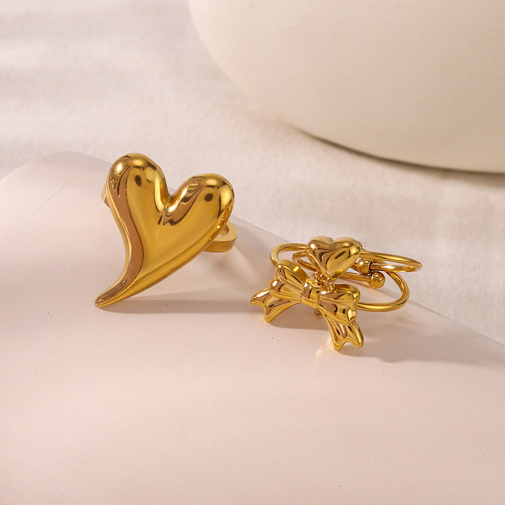 Anello minimalista a forma di fiocco e cuore in acciaio inossidabile con placcatura sottovuoto per uomo e donna