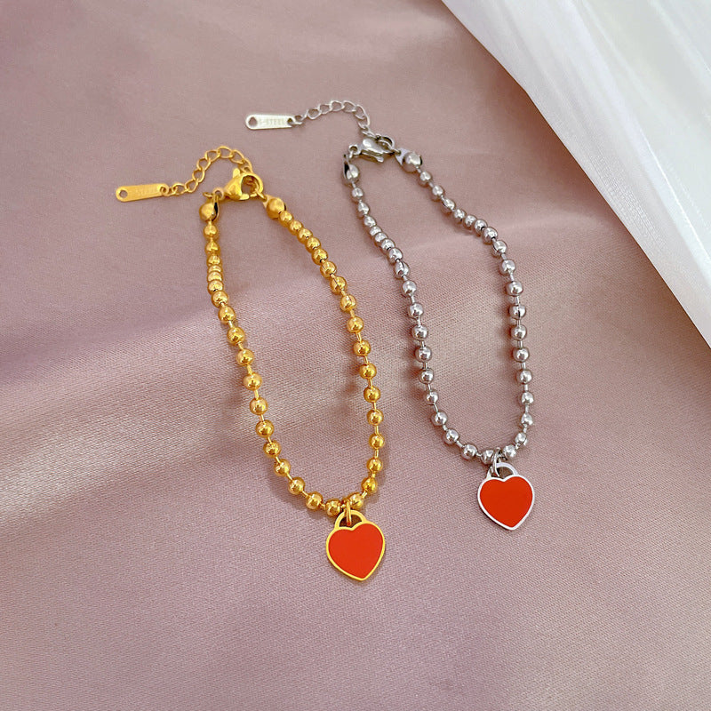 Bracciale da donna vintage bohémien a forma di cuore in acciaio al titanio placcato oro con texture ondulata