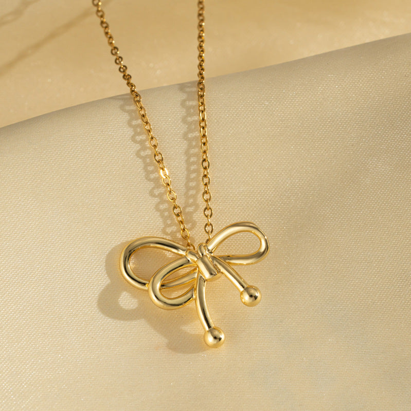 Collana di lusso in acciaio al titanio a forma di fiocco con finitura placcata oro e catena a serpente