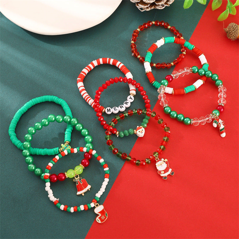 Set di bracciali natalizi fatti a mano in argilla polimerica da donna con ciondoli di Babbo Natale e fiocchi di neve in stile cartone animato giocoso