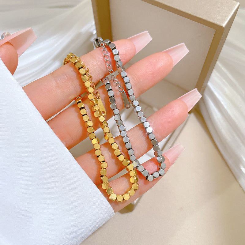 Bracciale Minimalista da Donna a Catena Box in Acciaio al Titanio Tonalità Fredde con Design Zodiacale e Intarsio in Oro