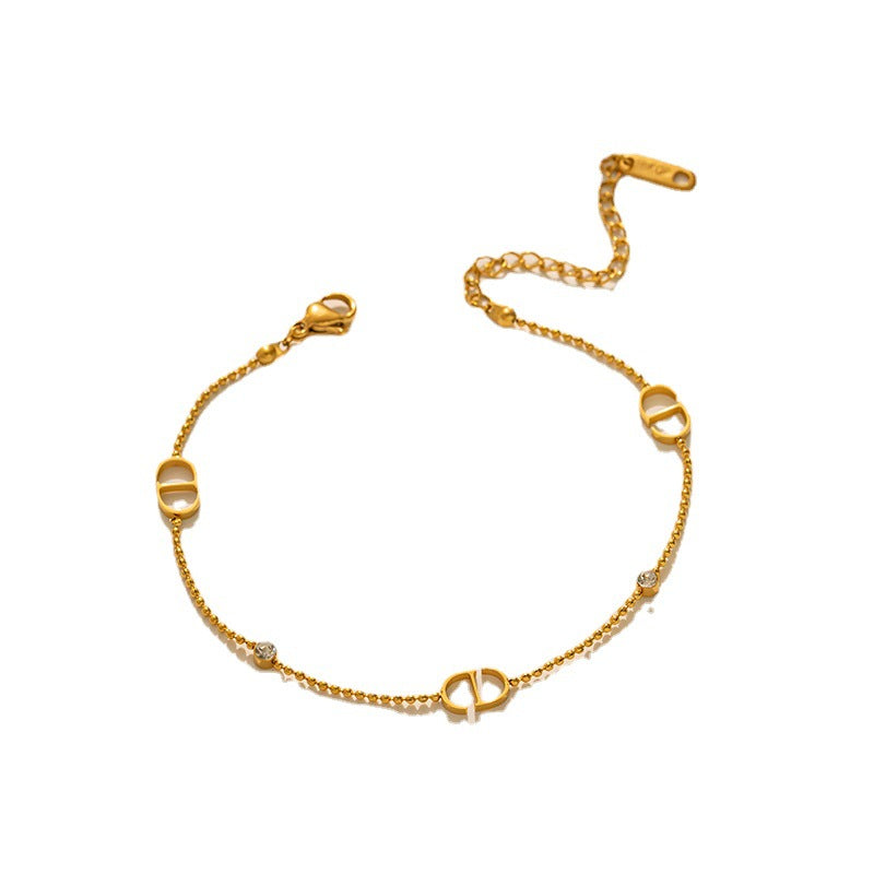 Collana con ciondolo a lettera minimalista da donna in acciaio al titanio con intarsio di strass e finitura lucida