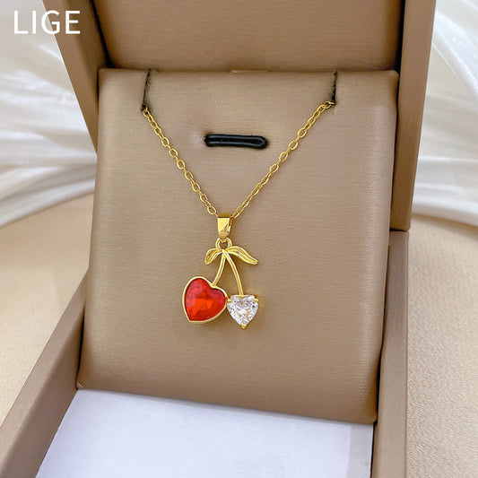 Collar con colgante de frutas en forma de corazón y cereza estilo caricatura para mujer con incrustaciones de diamantes de imitación en cadena de acero inoxidable