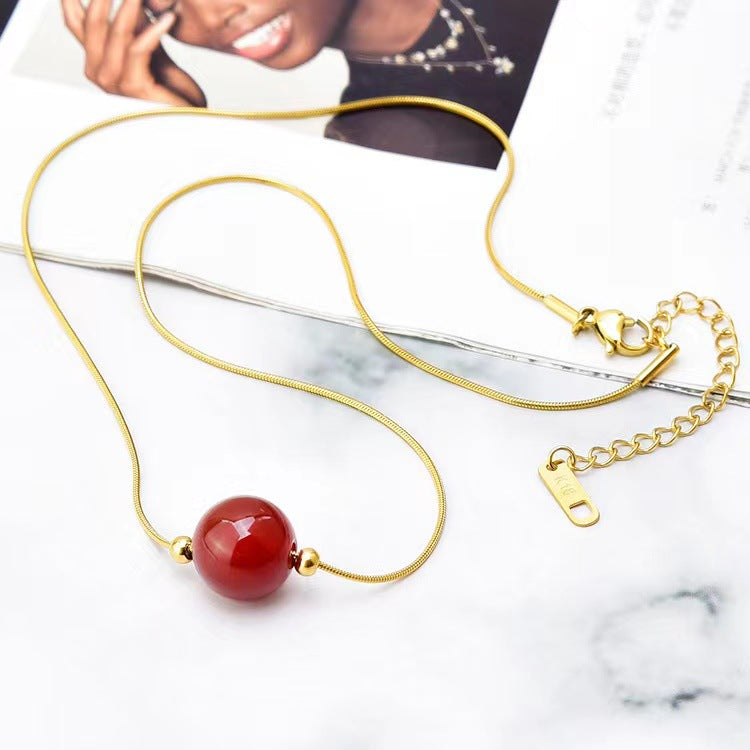 Geometric Titanium Steel Snake Chain Necklace with Gold-Plated Lucky Bean Pendant and Genuine Agate Beads