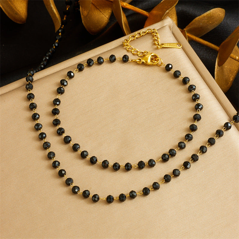Set di collana e bracciale da donna bohémien vintage in acciaio inossidabile con perline nere in resina
