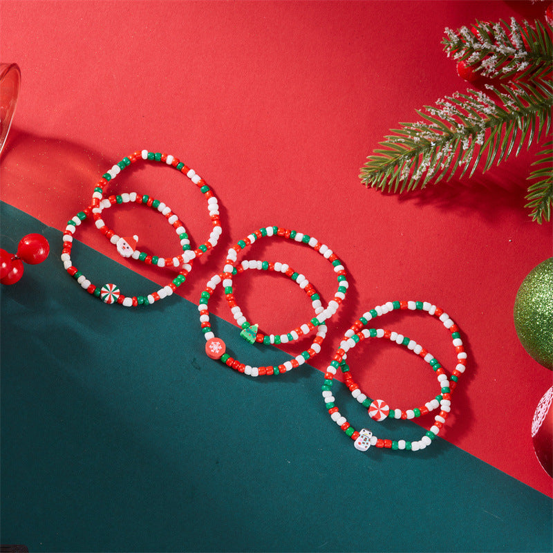 Set di bracciali natalizi fatti a mano in argilla polimerica con ciondoli a fiocco di neve e Babbo Natale per coppie
