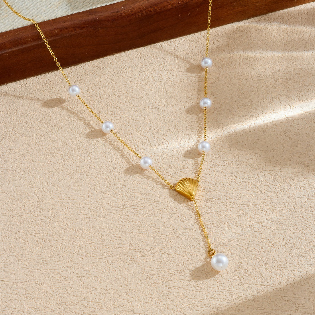 Elegant Gold Plated Stainless Steel Y-Chain Necklace with Seashell Pendant and Pearl Accent for Women