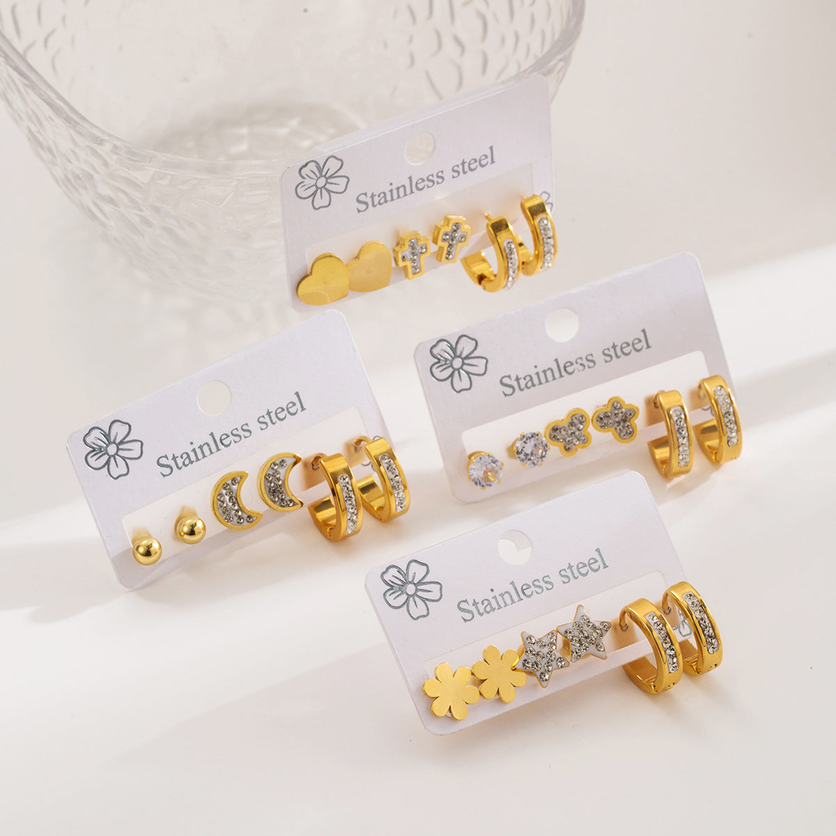 Eleganti orecchini geometrici a forma di stella in acciaio inossidabile con intarsi di strass e placcatura in oro da donna