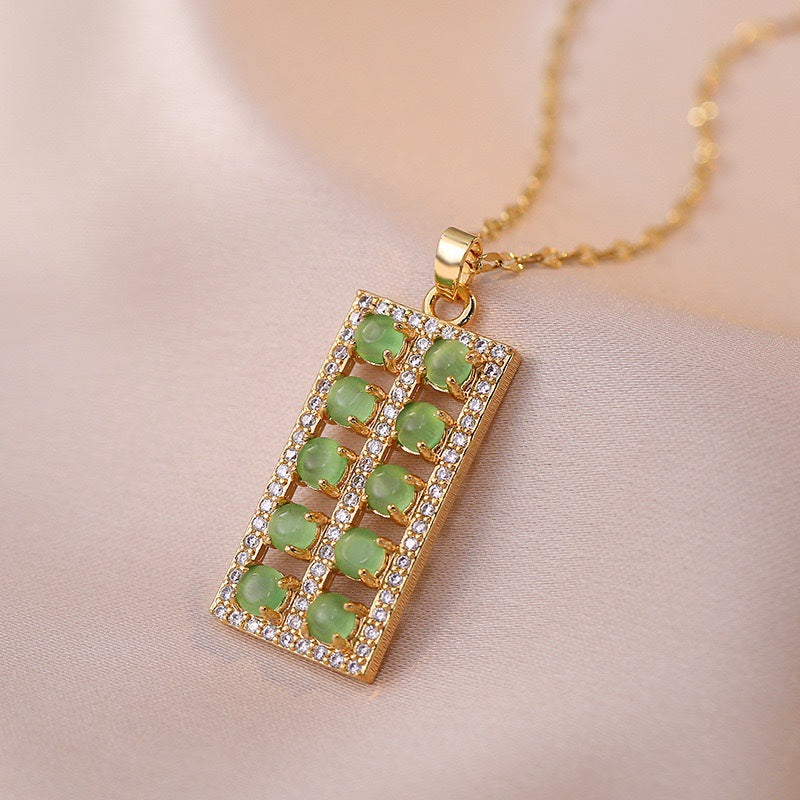 Collana con ciondolo floreale dal design originale per donne e uomini in acciaio al titanio con intarsio in rame placcato oro e catena a O