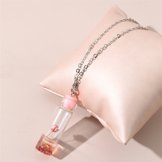 Collar con colgante de cristal geométrico minimalista para niños con flores secas rosas y encapsulación de resina