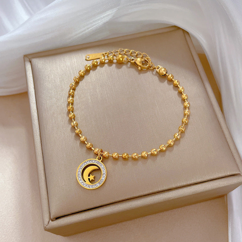 Bracciale Pendente Vintage Stella e Luna da Donna in Acciaio al Titanio Placcato Oro con Perline