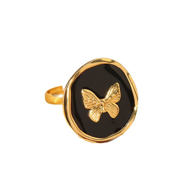 Anello Tondo in Acciaio Inossidabile con Farfalla Geometrica e Goccia Dolce