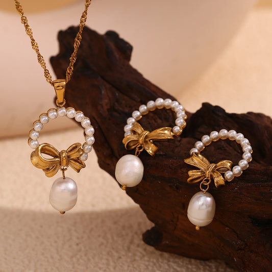 Vintage-Inspired Bow and Geometric Pendant Necklace for Women in Stainless Steel with 18K Gold Plating and Pearl Accents
