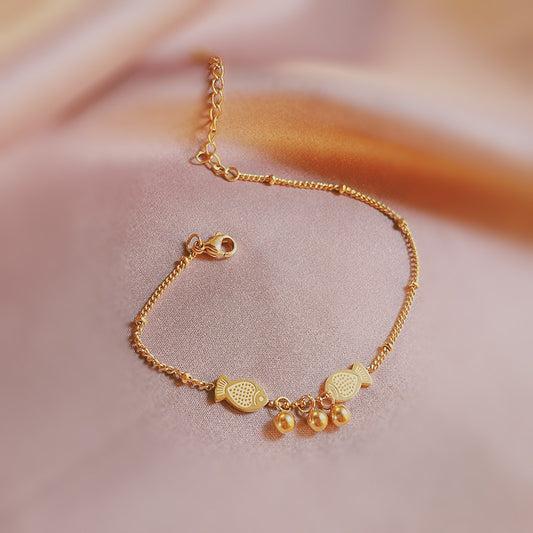 Pulsera con colgante original con forma de pez para mujer y hombre, de acero titanio chapado en tono dorado