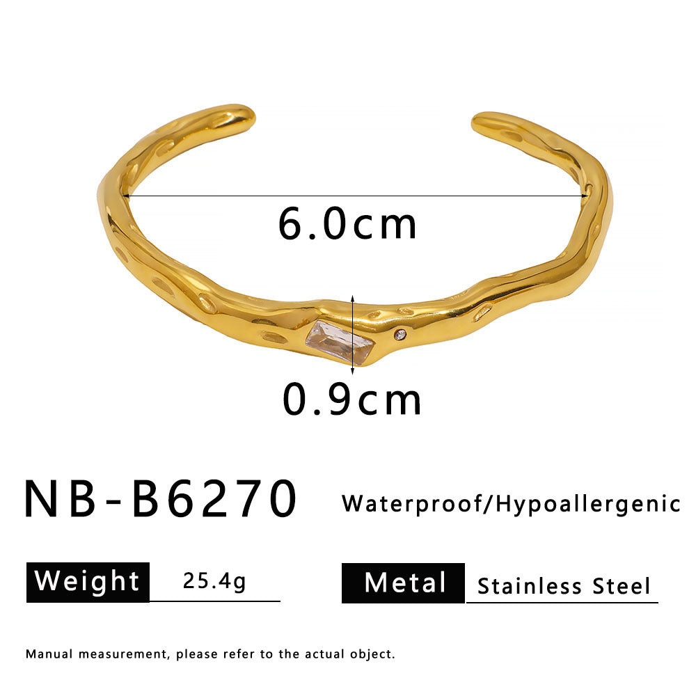 Geometric Twisted Wave Stainless Steel Bracelet with Rhinestone Accents and Polished Finish
