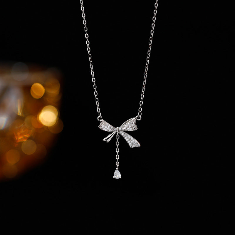 Minimalist Bow-Shaped Titanium Steel Pendant Necklace for Women with Plated Finish and Delicate Layered Look