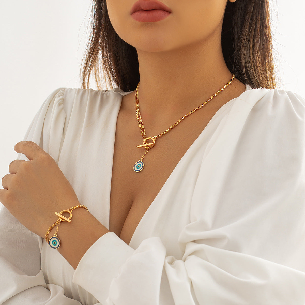 Collana pendente asimmetrica con nappe e ciondolo geometrico a forma di occhio in lega con finitura galvanica da donna
