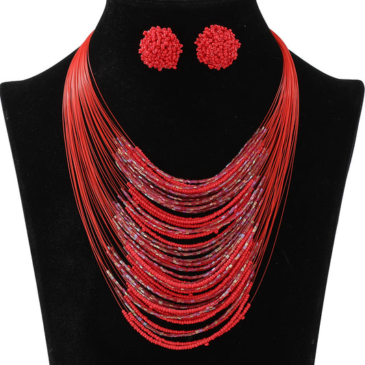 Set di collana e orecchini bohémien multistrato con perline di vetro per donna, con catena di perle e ciondolo a quattro semi