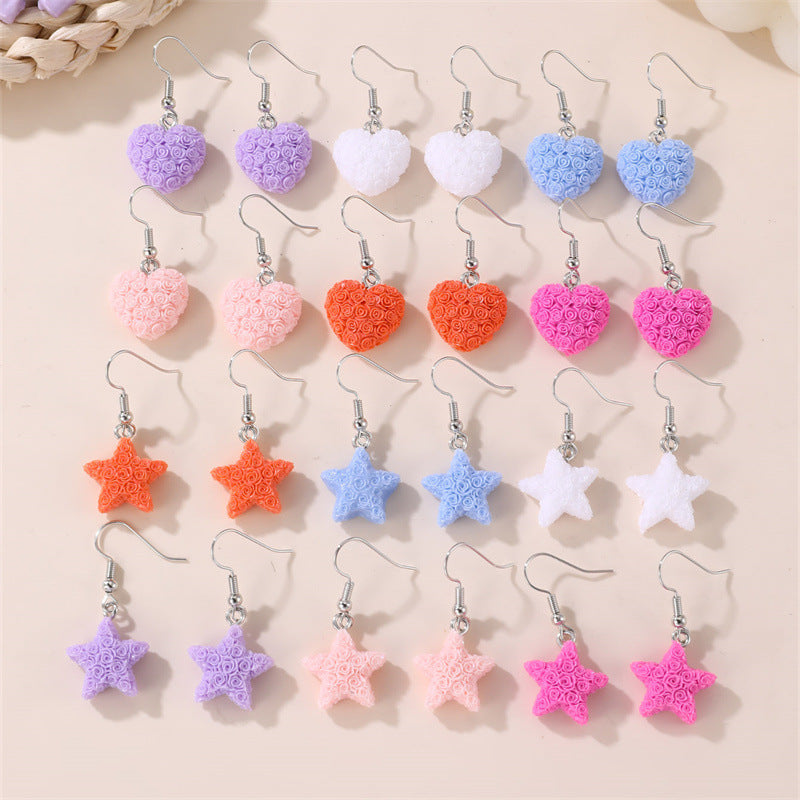 Set de aretes infantiles minimalistas con corazón floral, estrella y moño para niñas de 3 a 10 años, aretes de plástico y resina con incrustaciones de perlas