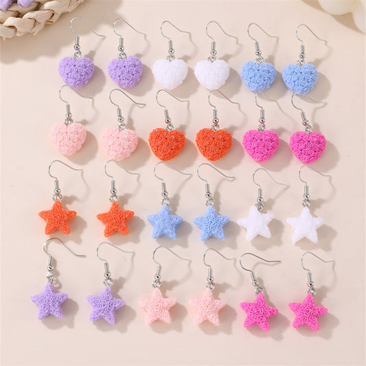 Set de aretes infantiles minimalistas con corazón floral, estrella y moño para niñas de 3 a 10 años, aretes de plástico y resina con incrustaciones de perlas