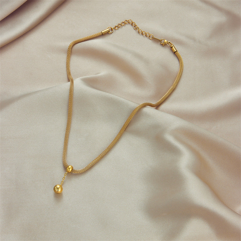 Minimalist Hollow Cylinder Pendant Necklace in Titanium Steel with Gold Beads and Tassel Detail for Women