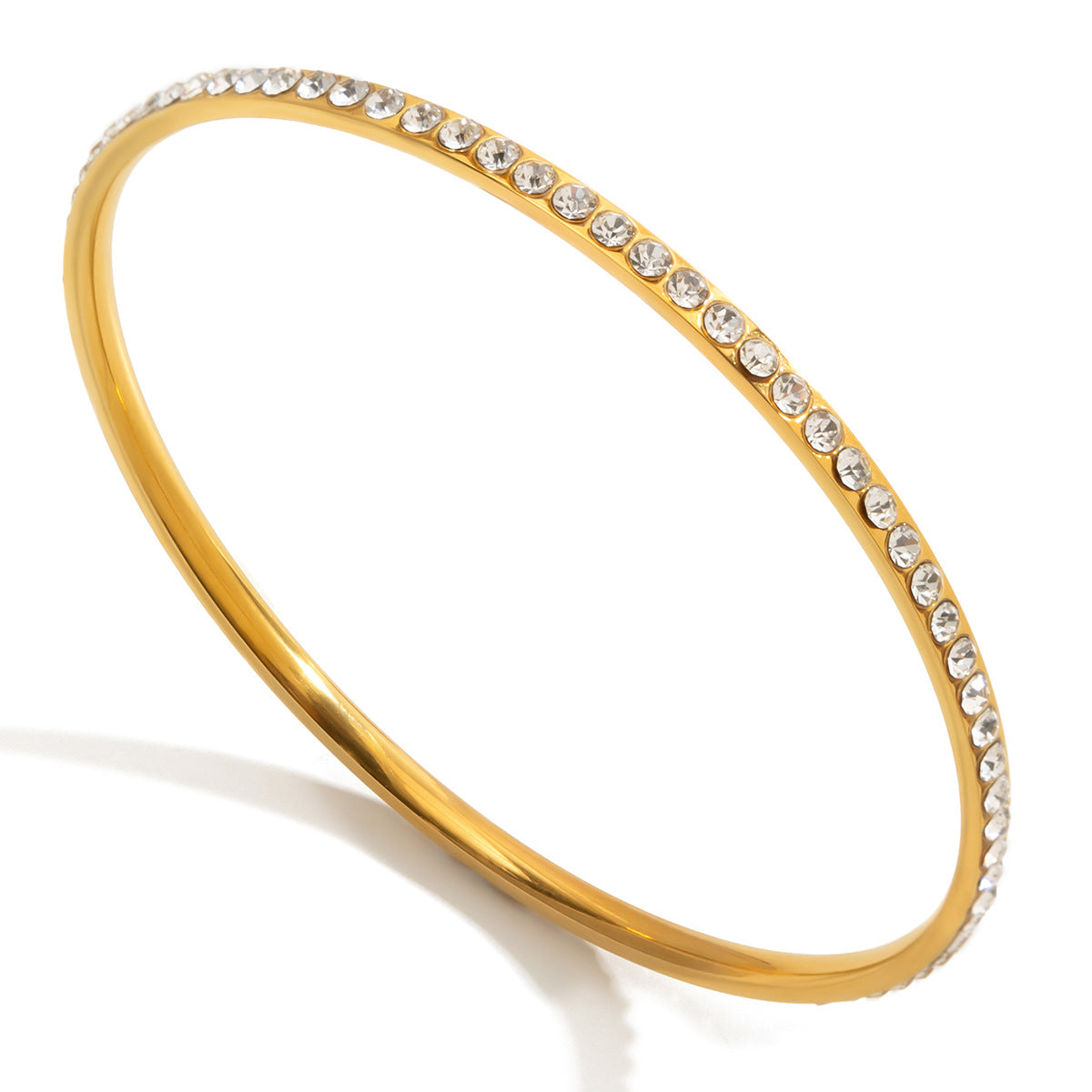 Elegante pulsera geométrica de acero inoxidable para mujer con incrustaciones de pedrería y acabado chapado
