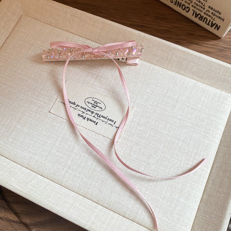 Pinza de pelo de aleación de estilo de lujo con forma de lazo y adornos de pedrería para mujer con detalles de perlas y diseño chic minimalista