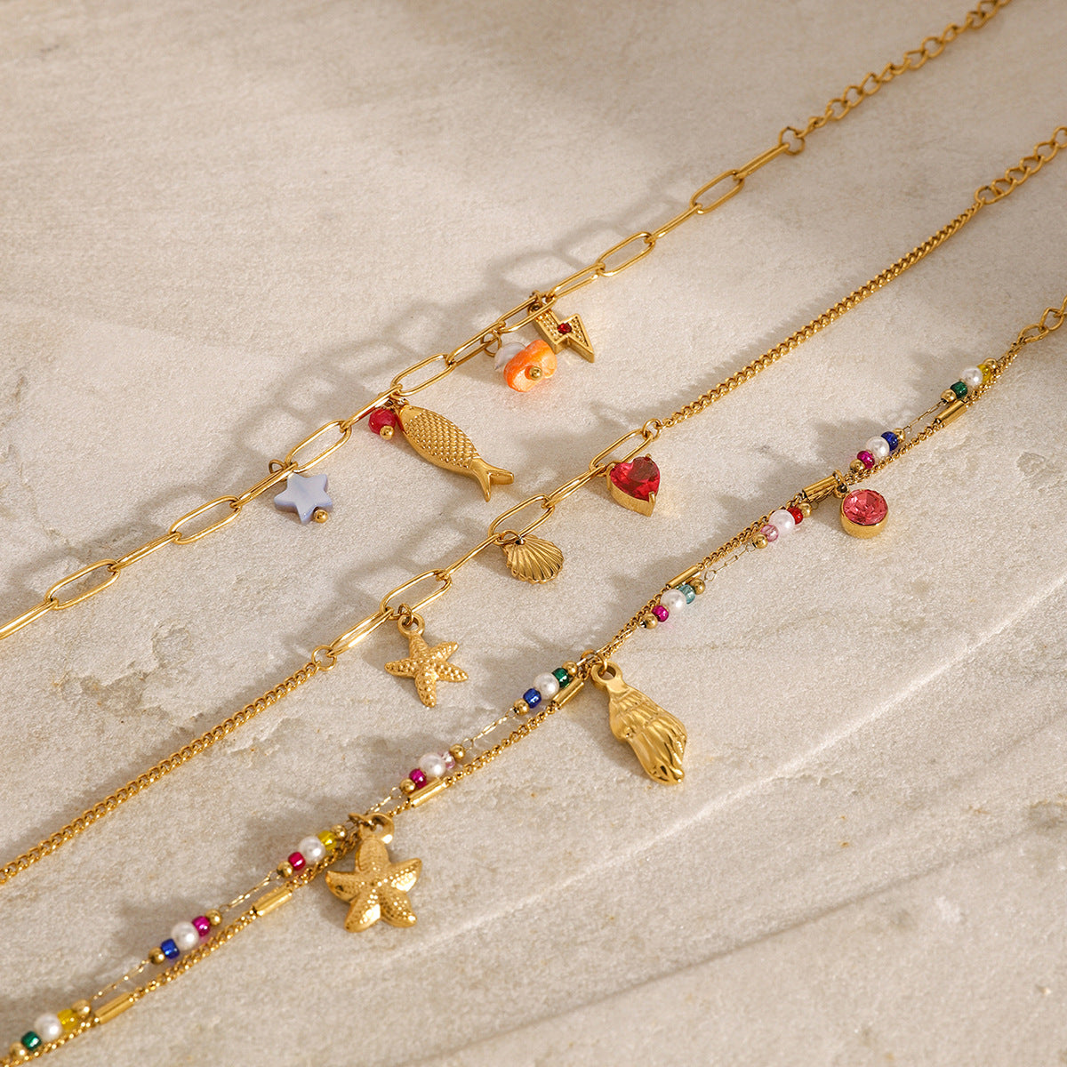 Bracciale da donna con ciondolo a barra in acciaio al titanio placcato oro 18 carati a forma di animale geometrico