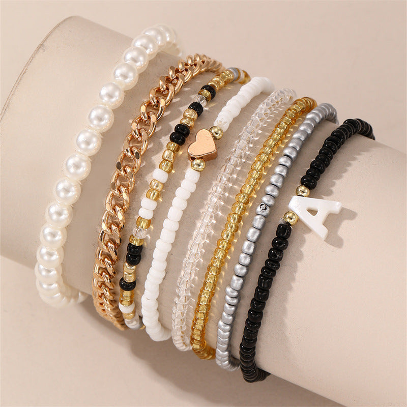 Set di Braccialetti con Lettere in Perle di Vetro a Cuore Minimalista per Bambini con Perle in Resina e Lavorazione Artigianale