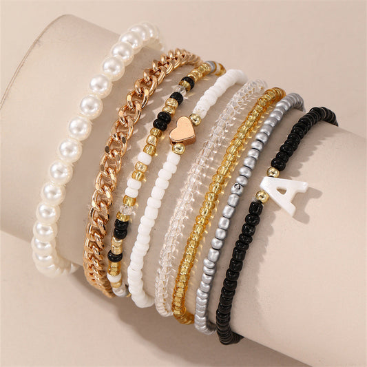 Set di Braccialetti con Lettere in Perle di Vetro a Cuore Minimalista per Bambini con Perle in Resina e Lavorazione Artigianale