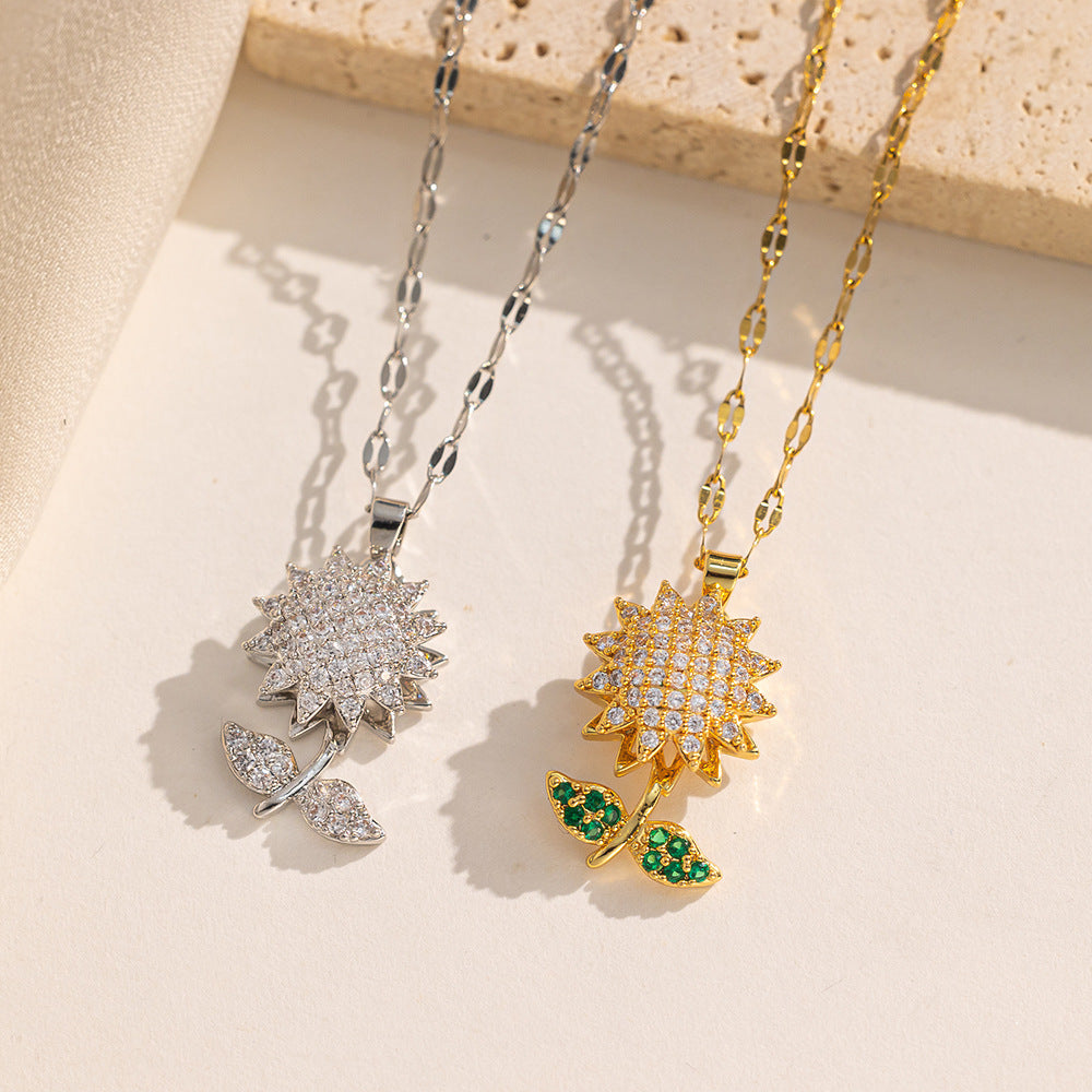 Collar con colgante de girasol geométrico para mujer con diseño de hojas verdes giratorias de doble capa en acero de titanio con incrustaciones de diamantes de imitación y cadena ondulada