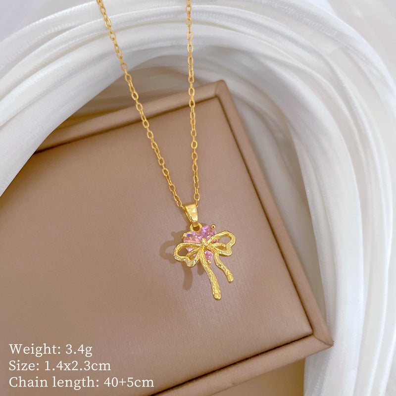 Collana con ciondolo a fiocco rosa con strass da donna in acciaio al titanio con catena a locket delicata
