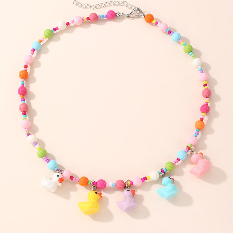 Collana con ciondolo a fiocco dolce pastello per ragazze con ciondolo in resina su catena a O, gioielli in stile cartone animato