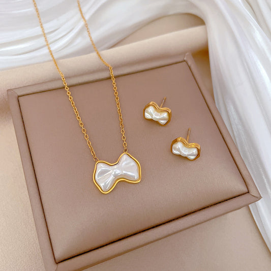 Minimalist Butterfly Knot Pearl Pendant Necklace for Women in Titanium Steel with Gold Plating and Delicate Clavicle Chain