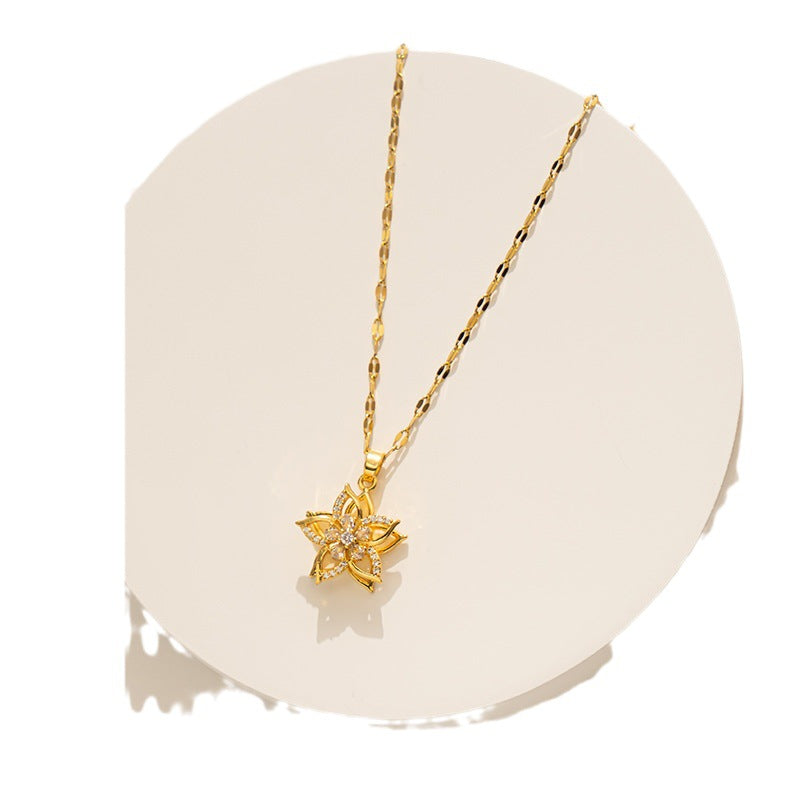 Collana pendente a fiore a cinque petali rotante minimalista da donna in acciaio al titanio con intarsi in strass e catena ondulata