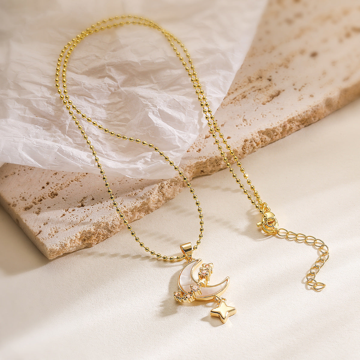 Minimalist Star and Moon Pendant Necklace for Women with Copper Base Plated in 18K Gold Featuring Zircon Inlay and Shell Accents